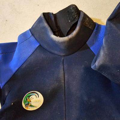 Sporting items for several sports - O'Neill Wet suit - Tennis balls - golfing - and a hiking backpack