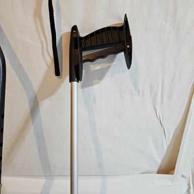 Adjustable aluminum cane and a Gripper stick tool