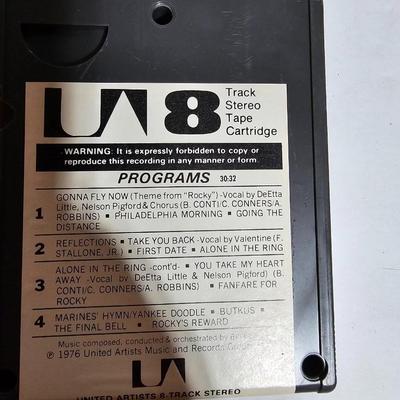 Seven 8 track cassettes in near mint condition - all soundtracks Rocky - Songbird and more