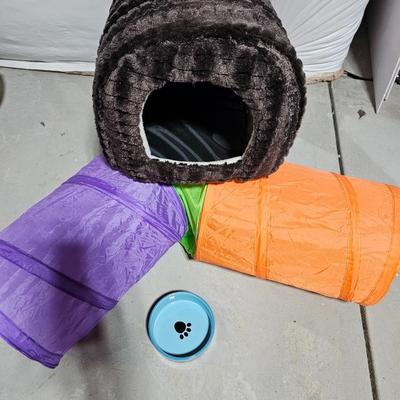 Cat play tunnel and a cat bed with ceramic food bowl