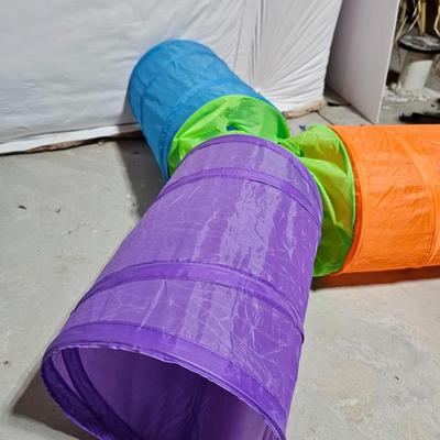 Cat play tunnel and a cat bed with ceramic food bowl