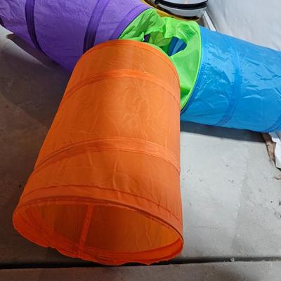 Cat play tunnel and a cat bed with ceramic food bowl