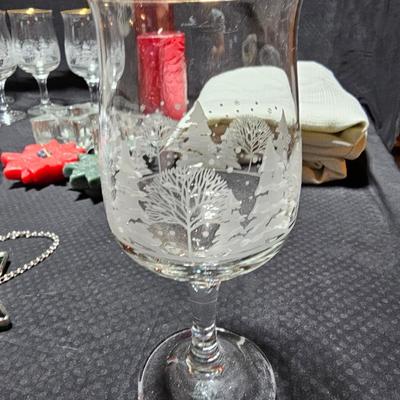 Christmas dinnerware, and decorations, Libbey wine glasses w/Etched Trees, Glass platter with Raised Scene and more