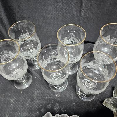 Christmas dinnerware, and decorations, Libbey wine glasses w/Etched Trees, Glass platter with Raised Scene and more