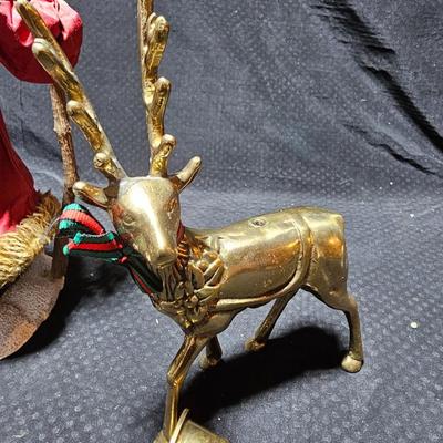 Santa clause with two brass deer