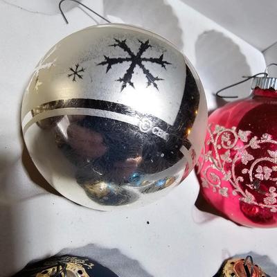 Vintage glitter decorated Christmas bulbs with four elegant stockings