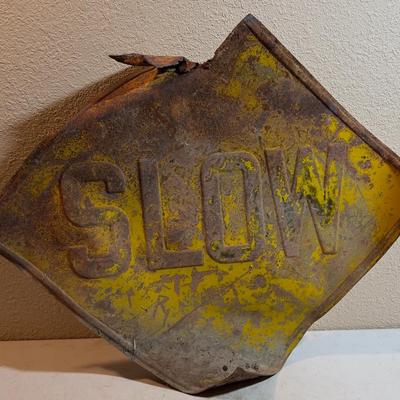 SLOW Beat up road sign, made out of Steel