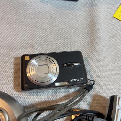 Digital Camera With Charging Cables.