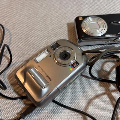 Digital Camera With Charging Cables.