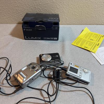 Digital Camera With Charging Cables.