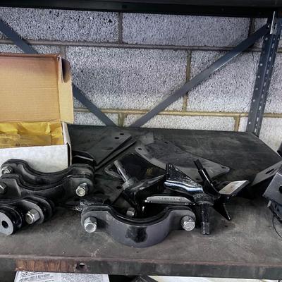 Pile of Suspension and Under Carriage Brackets