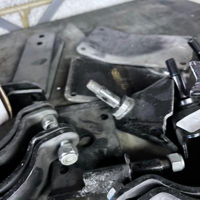 Pile of Suspension and Under Carriage Brackets