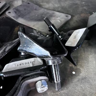 Pile of Suspension and Under Carriage Brackets