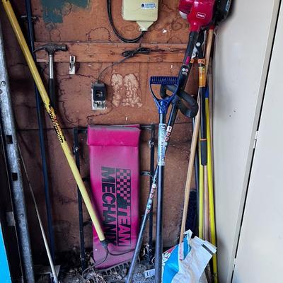 Yard tools north side of Cabinet