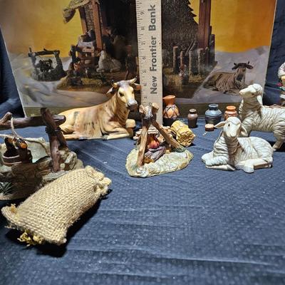 Collectible Porcelain Nativity set with wood Creche and accessories with wood based nativity people