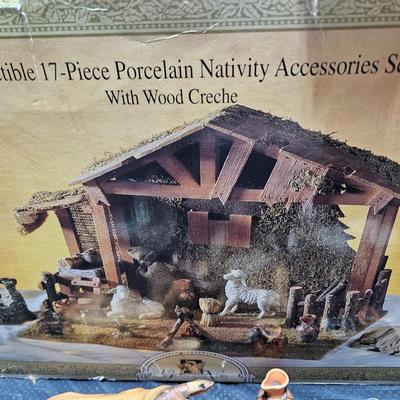 Collectible Porcelain Nativity set with wood Creche and accessories with wood based nativity people