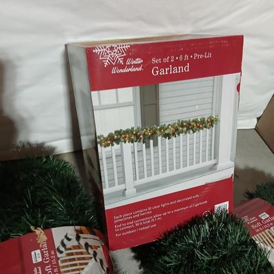Christmas Garland - 2 6-foot Lit garland new in box and three 50-foot Garlands also new