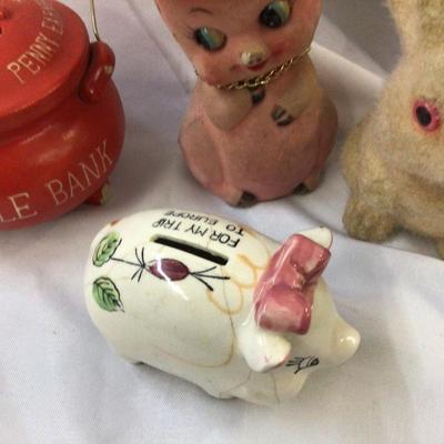 Sale Photo Thumbnail #348: You get this great lot of banks, two pig a bunny, a red kettle and another pottery pig banks.  All vintage and the two pottery ones have a little damage but not bad for their age.