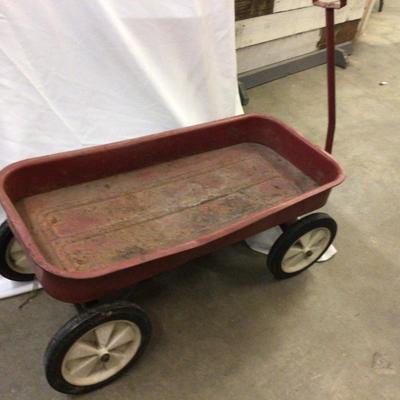 Sale Photo Thumbnail #393: This is a great vintage metal red wagon.  It does have plastic wheels, and some rust but overall in good condition.  Would be great with flowers in it inna flower bed.