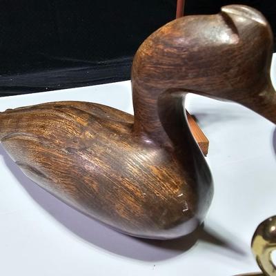Two nice wooden ducks with brass geese and a duck on a post