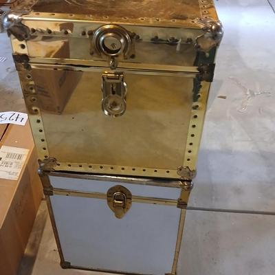 Two metal and wood storage trunks