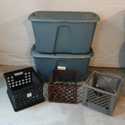Two 32 gallon storage totes with lids and three milk like crates