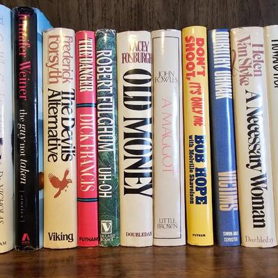 Shelves of books - mostly vintage hardbacks with Dust Jackets