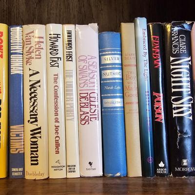 Shelves of books - mostly vintage hardbacks with Dust Jackets