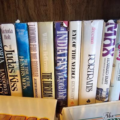 Shelves of books - mostly vintage hardbacks with Dust Jackets