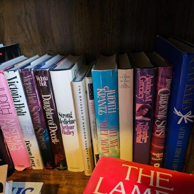 Shelves of books - mostly vintage hardbacks with Dust Jackets