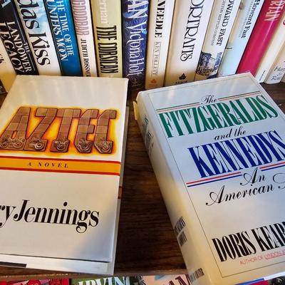Shelves of books - mostly vintage hardbacks with Dust Jackets