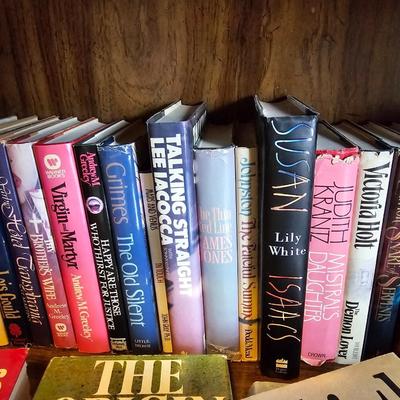 Shelves of books - mostly vintage hardbacks with Dust Jackets