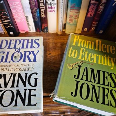 Shelves of books - mostly vintage hardbacks with Dust Jackets