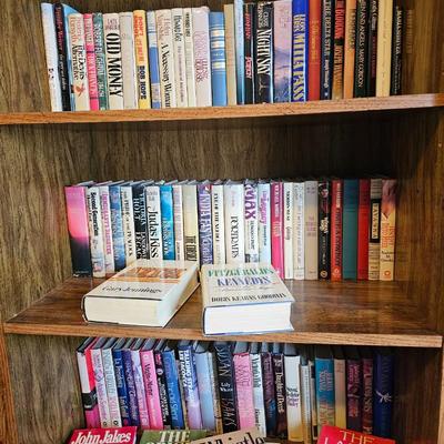 Shelves of books - mostly vintage hardbacks with Dust Jackets