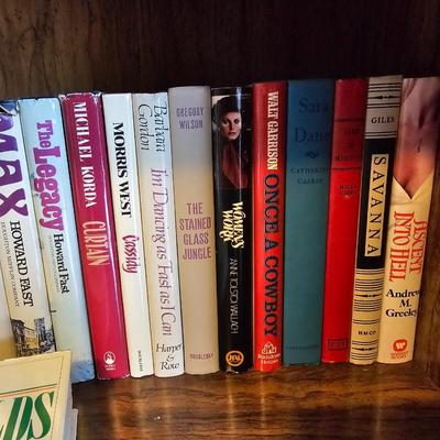 Shelves of books - mostly vintage hardbacks with Dust Jackets