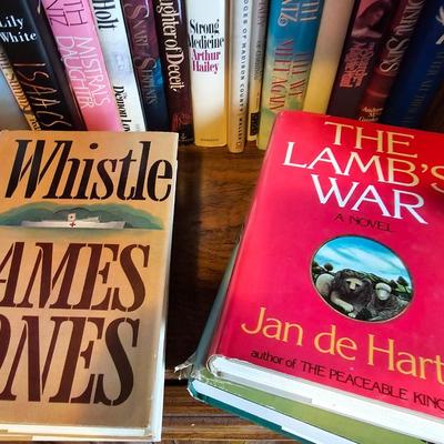 Shelves of books - mostly vintage hardbacks with Dust Jackets