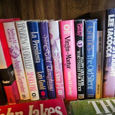 Shelves of books - mostly vintage hardbacks with Dust Jackets