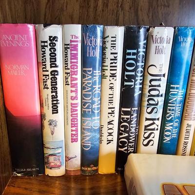 Shelves of books - mostly vintage hardbacks with Dust Jackets