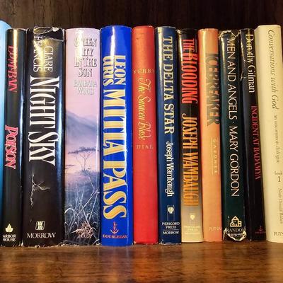 Shelves of books - mostly vintage hardbacks with Dust Jackets
