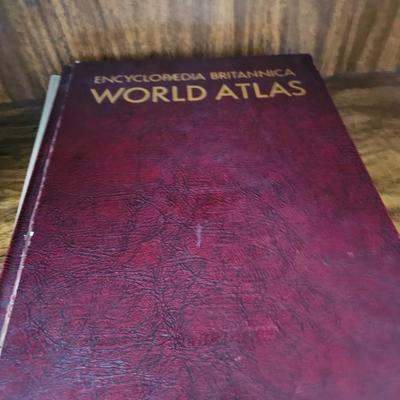 Vintage glass globe paper weight with stand and two World Atlas hardback books
