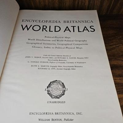 Vintage glass globe paper weight with stand and two World Atlas hardback books