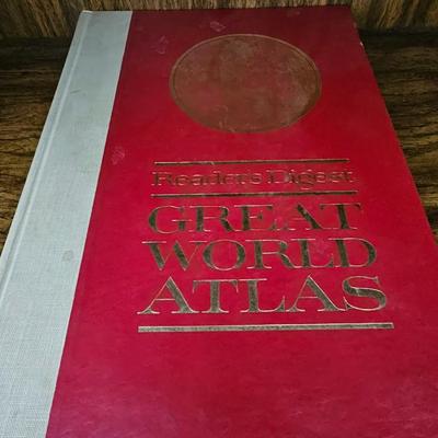 Vintage glass globe paper weight with stand and two World Atlas hardback books