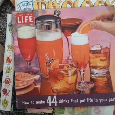 Some way cool vintage cookbooks and pamphlet like cook & drink mixing books