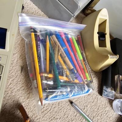 Large assortment of office supplies with metal storage, adding machine, lamp and more