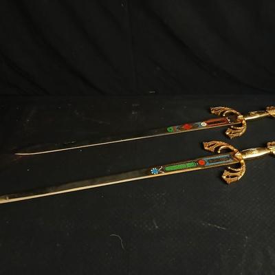Two metal decorative swords