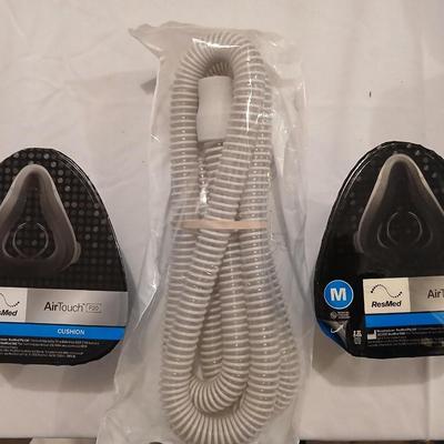 Two Medium AirTouch ResMed F20 cushions with one hose SEALED BRAND NEW
