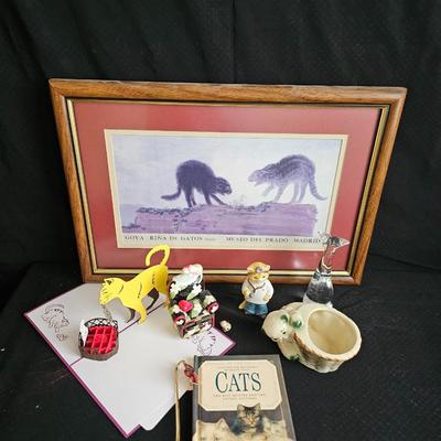 Everything cat! Cat figures, book with bookmarker, glass cat, and framed Goya Rina De Gatos detalle