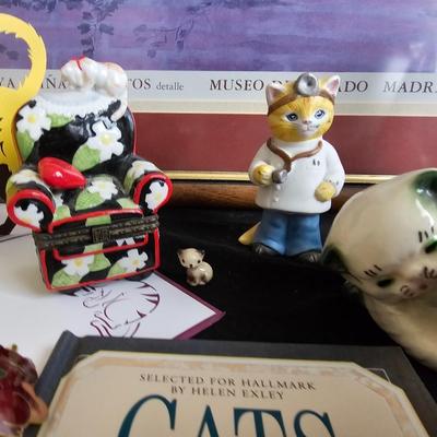 Everything cat! Cat figures, book with bookmarker, glass cat, and framed Goya Rina De Gatos detalle