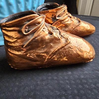 Vintage baby buggy planter with antique Bronzed baby shoes