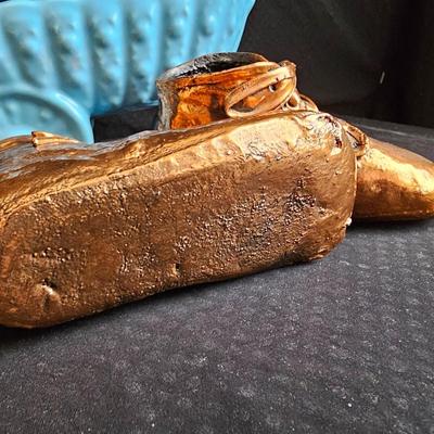 Vintage baby buggy planter with antique Bronzed baby shoes